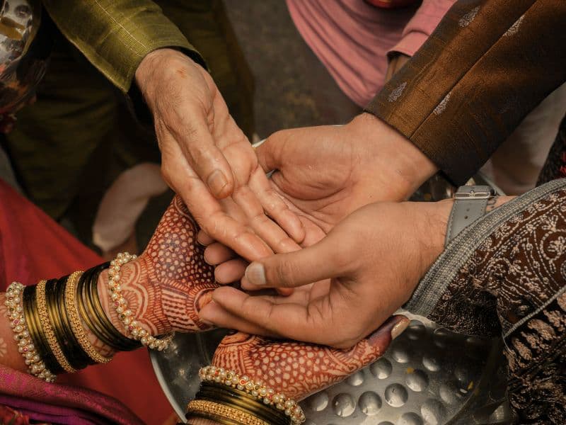 Holding hands representing the different generations in the South Asian community