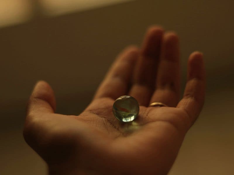 Controlling the movement of a marble at the palm of your hand.