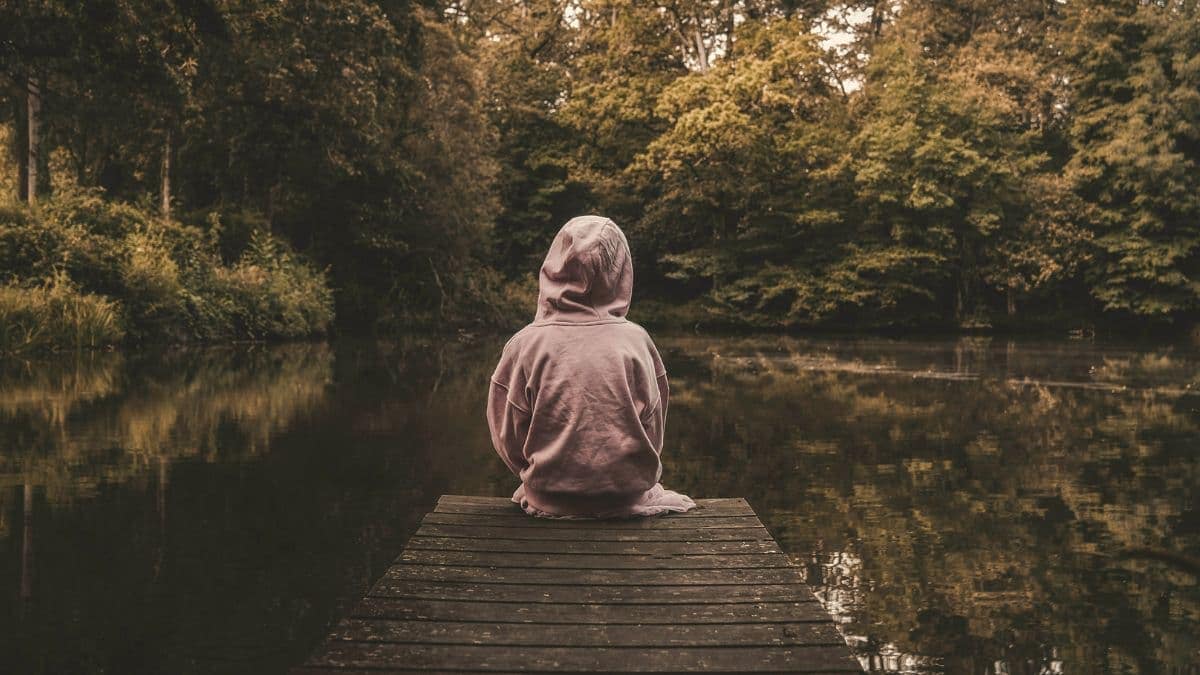 Reflecting on dock by calm waters.