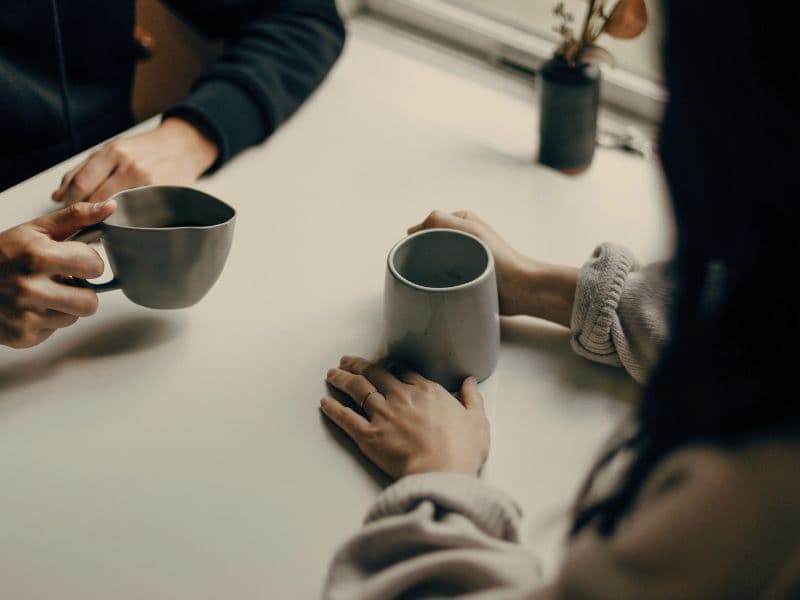Peaceful coffee chat representing the supportive and non-judgemental environment of therapy.