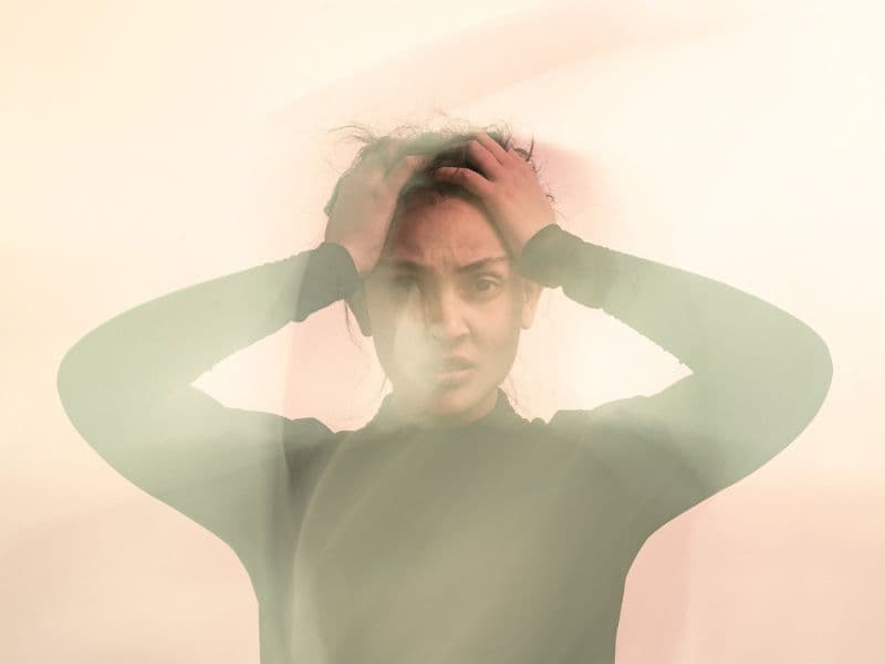 Woman feeling anxious and overwhelmed.