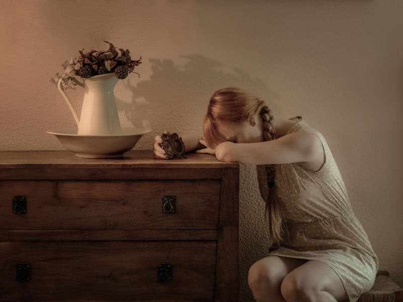 Upset woman feeling shame and needing to decompress.