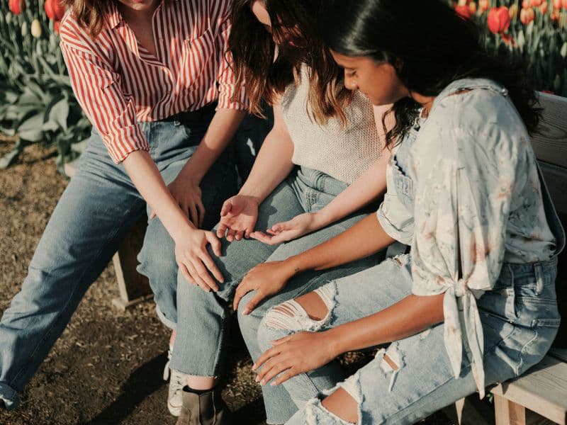 Friends calmly supporting one another.