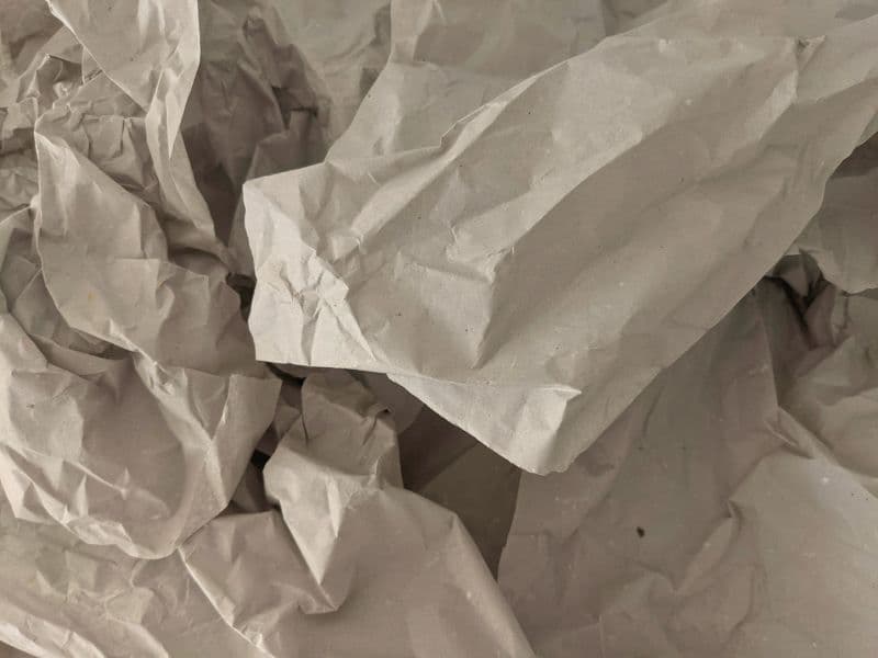 Crumpled paper representing the idea that a survivor will never be the same person they were before their abuse and that's okay.