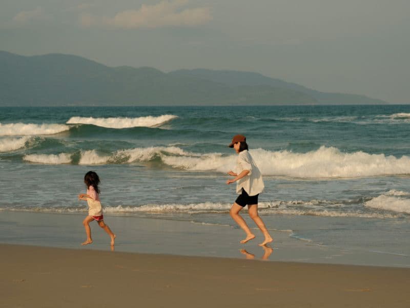 Adult chasing child representing adult trying to catch up with younger self to understand past memories.