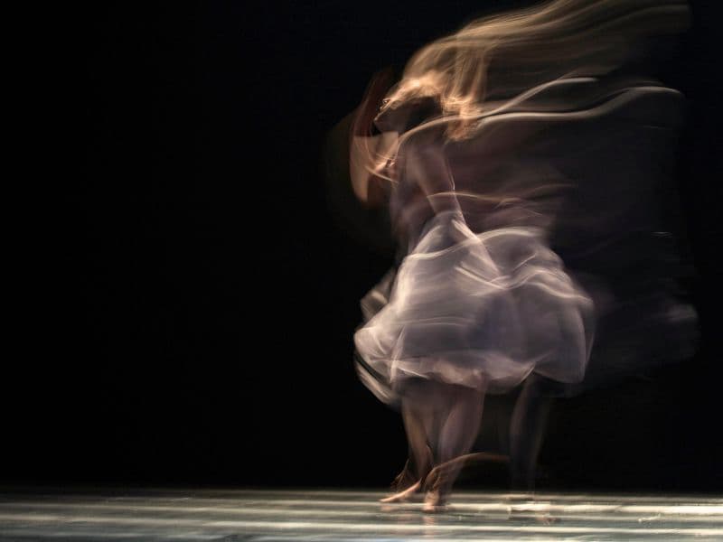 Woman looking like she's having an out-of-body experience representing dissociation.