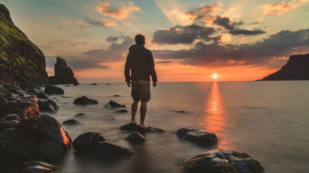 Looking at the sunrise representing nature's reminder to begin again.