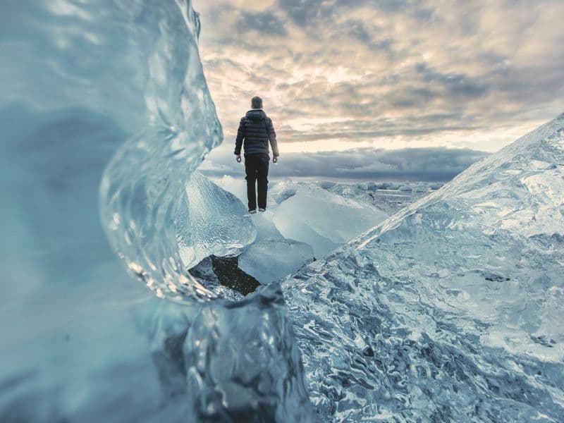 Man standing still on ice, representing freeze as a survival mechanism.