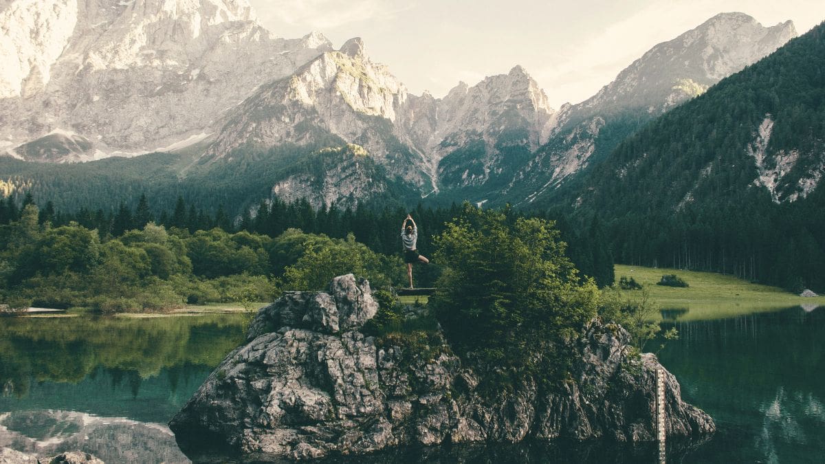 Person practicing a grounding exercise in nature to help manage anxiety.