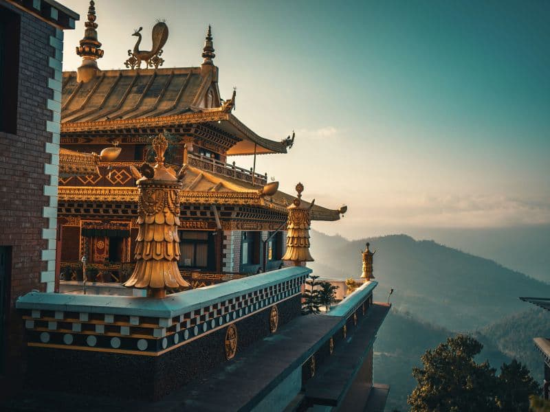 Temple situated at high altitude representing cultural traditions and values within South Asian communities.